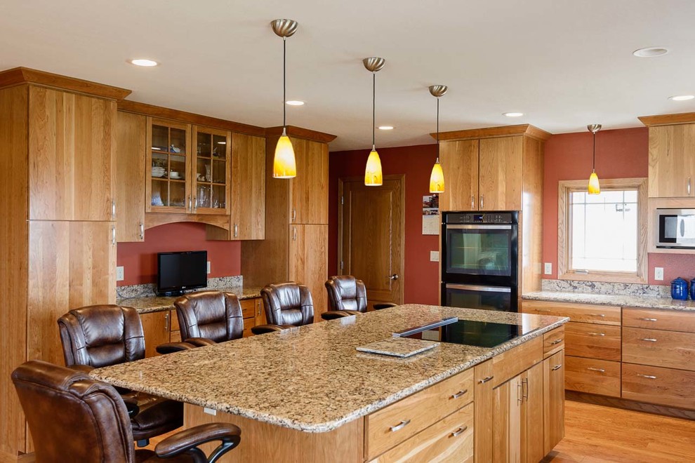 This is an example of a traditional kitchen in Other with engineered stone countertops and an island.