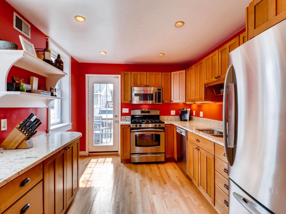 Small contemporary galley enclosed kitchen in Baltimore with a double-bowl sink, light hardwood flooring and no island.
