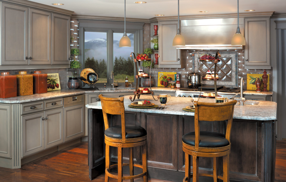 Open concept kitchen - mid-sized eclectic l-shaped dark wood floor open concept kitchen idea in Seattle with an undermount sink, recessed-panel cabinets, gray cabinets, granite countertops, metallic backsplash, metal backsplash, stainless steel appliances and an island