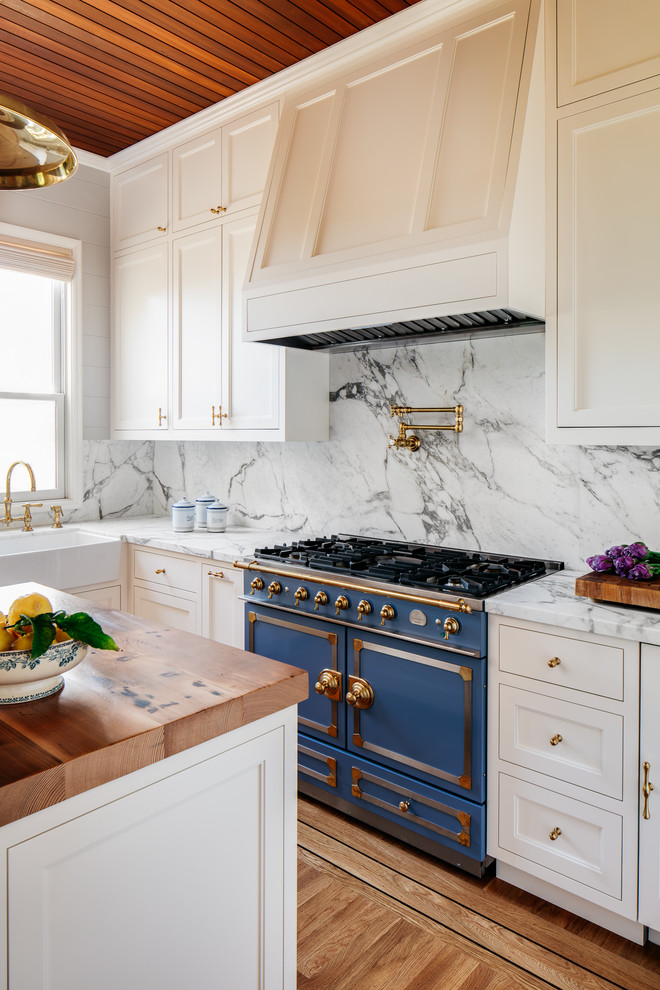 Kitchen - transitional kitchen idea in San Francisco with beaded inset cabinets and an island
