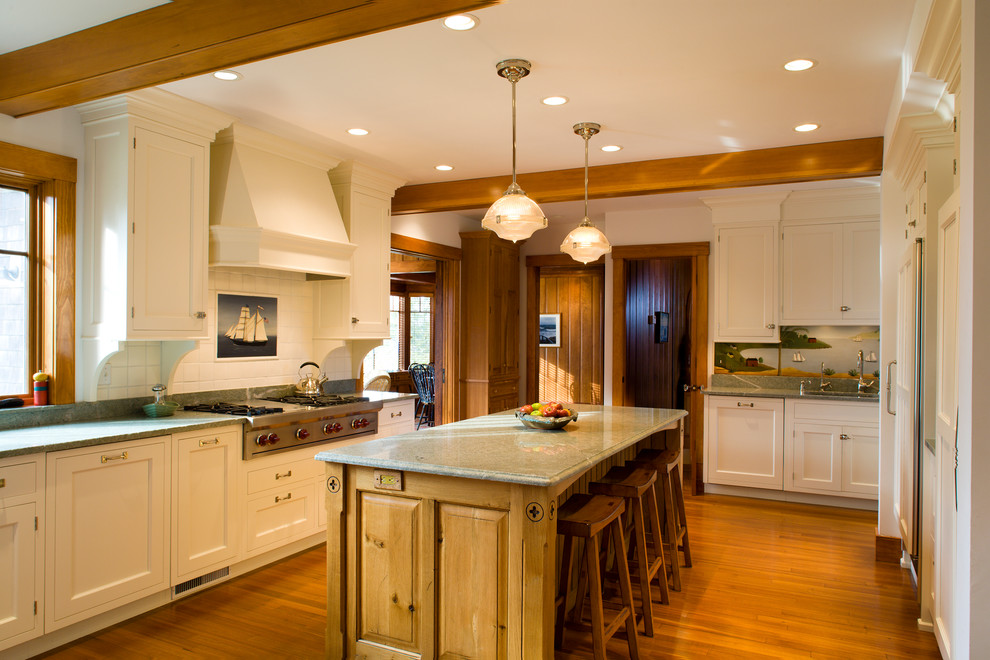 Inspiration for a timeless kitchen remodel in Boston with white cabinets and paneled appliances