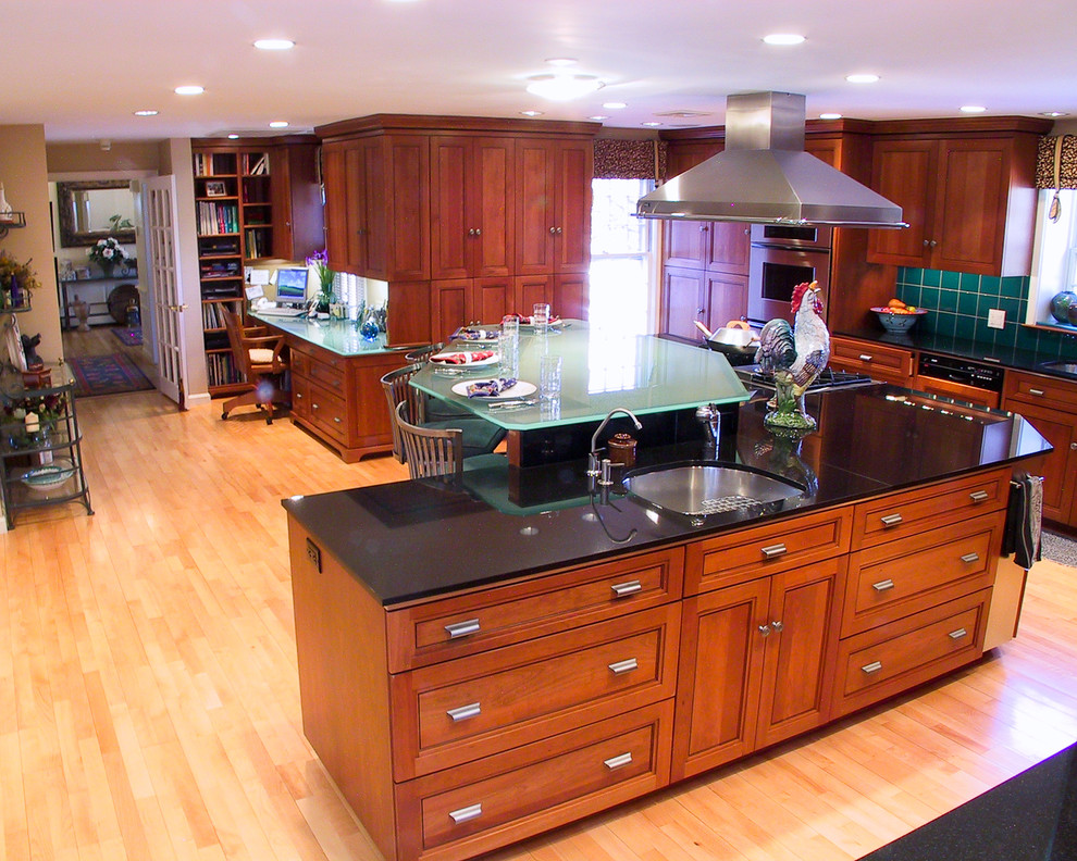 Elegant kitchen photo in Boston with glass countertops