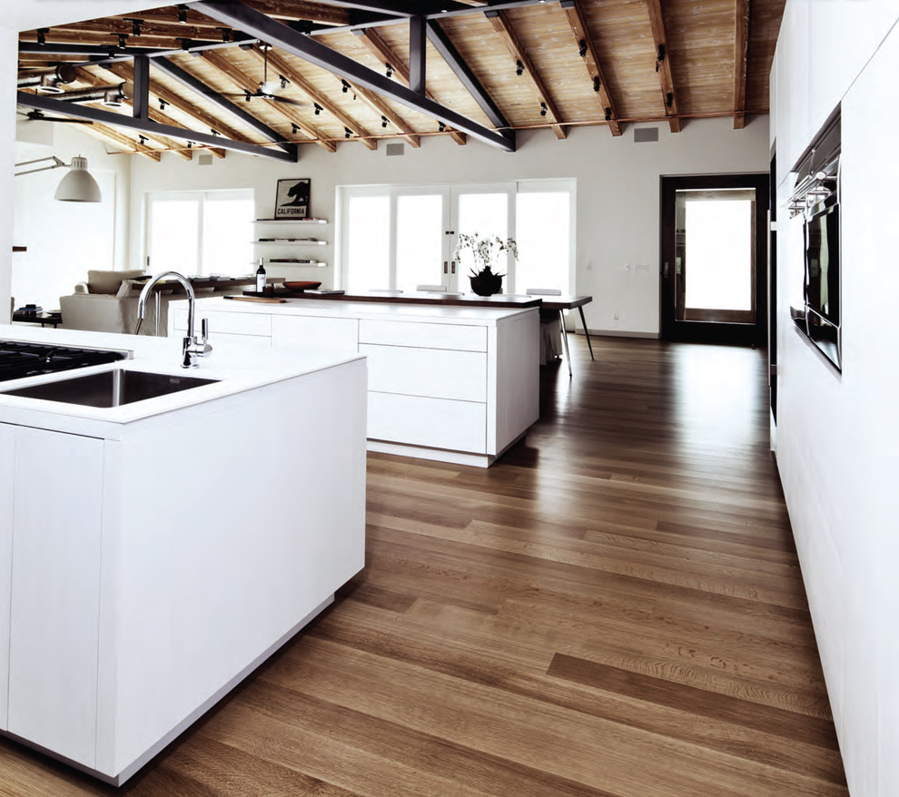 Inspiration for a contemporary open plan kitchen in Los Angeles with flat-panel cabinets and white cabinets.