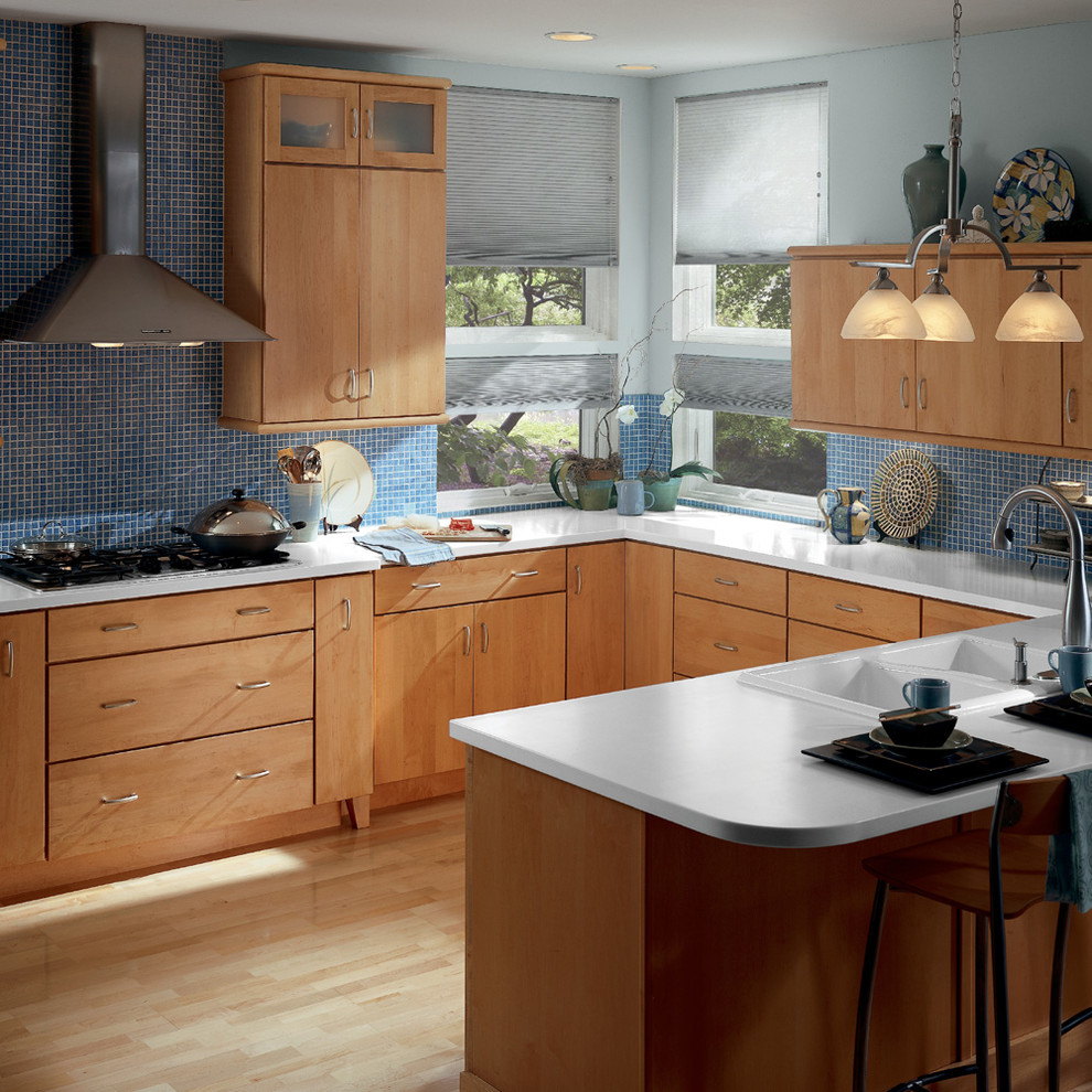 Example of a kitchen design in Detroit with flat-panel cabinets and light wood cabinets