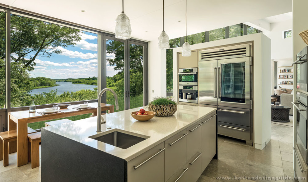 Design ideas for a small contemporary kitchen in Boston with stainless steel appliances and limestone flooring.