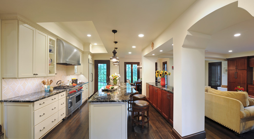 Inspiration for a mediterranean open plan kitchen in Columbus with stainless steel appliances.