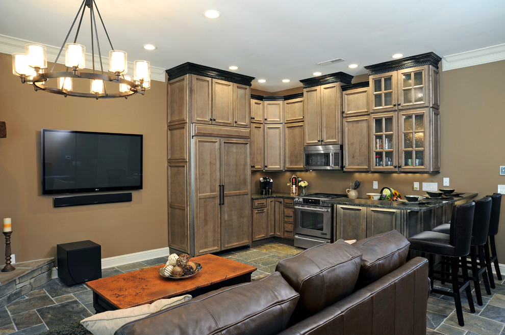 Example of a small mountain style l-shaped slate floor open concept kitchen design in Cincinnati with beaded inset cabinets, brown cabinets, granite countertops, paneled appliances and a peninsula