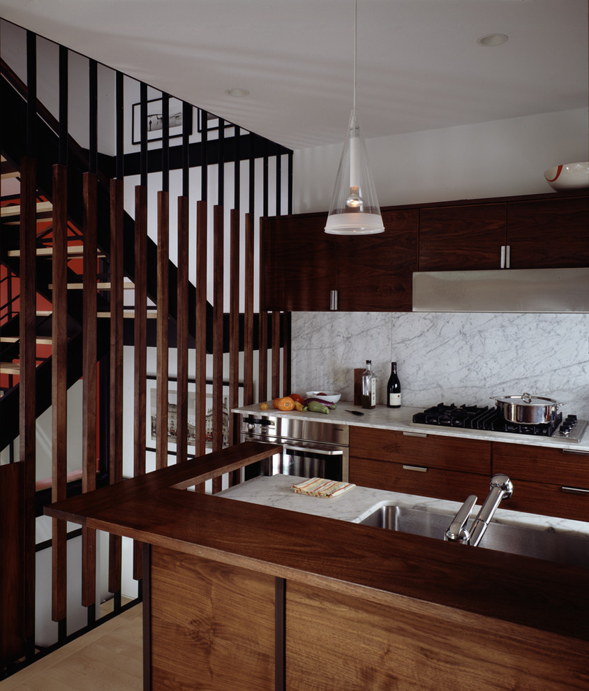 Inspiration for a modern kitchen in New York with stainless steel appliances and marble worktops.