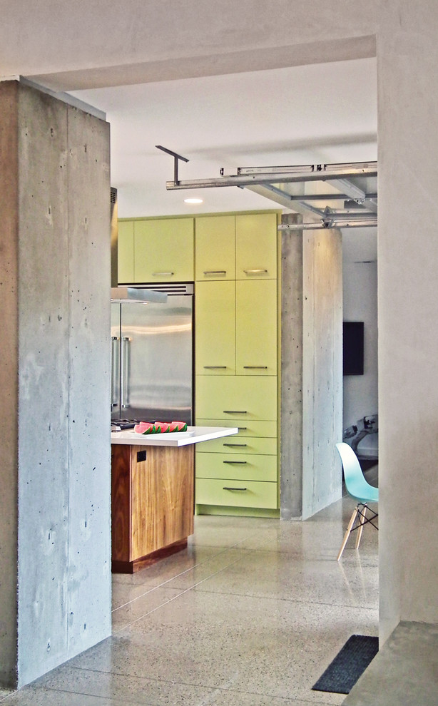 Example of a minimalist kitchen design in Denver with green cabinets