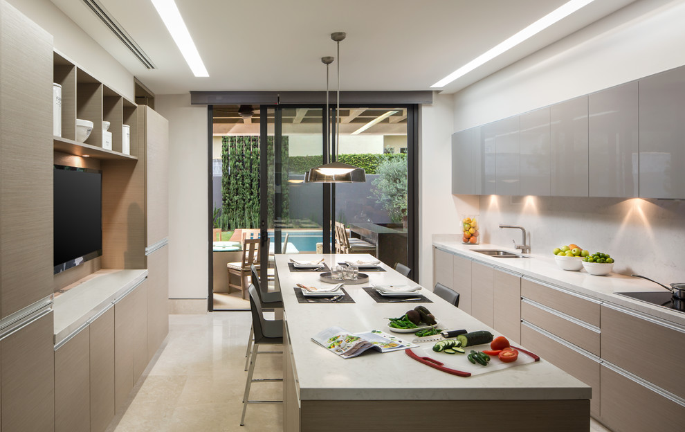 Trendy kitchen photo with a double-bowl sink, flat-panel cabinets, beige cabinets, white backsplash and an island