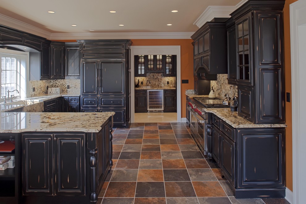 Inspiration for a timeless u-shaped multicolored floor kitchen remodel in DC Metro with raised-panel cabinets, granite countertops, a farmhouse sink, distressed cabinets, multicolored backsplash and stone slab backsplash