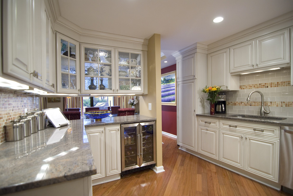 Kitchen - contemporary kitchen idea in DC Metro with an undermount sink, raised-panel cabinets, white cabinets, multicolored backsplash and subway tile backsplash