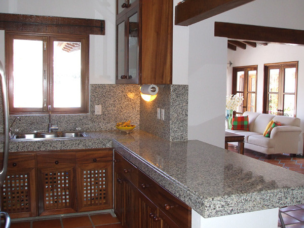 Example of an island style kitchen design in Other