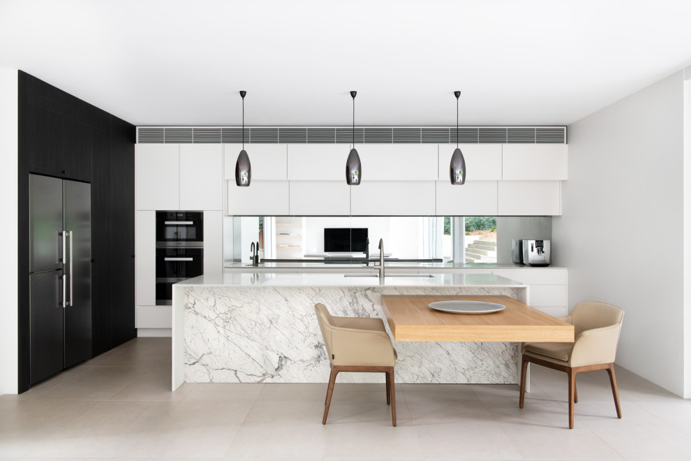 Design ideas for a large contemporary single-wall kitchen/diner in Sydney with a double-bowl sink, white cabinets, composite countertops, metallic splashback, mirror splashback, stainless steel appliances, cement flooring, multiple islands, grey floors and white worktops.