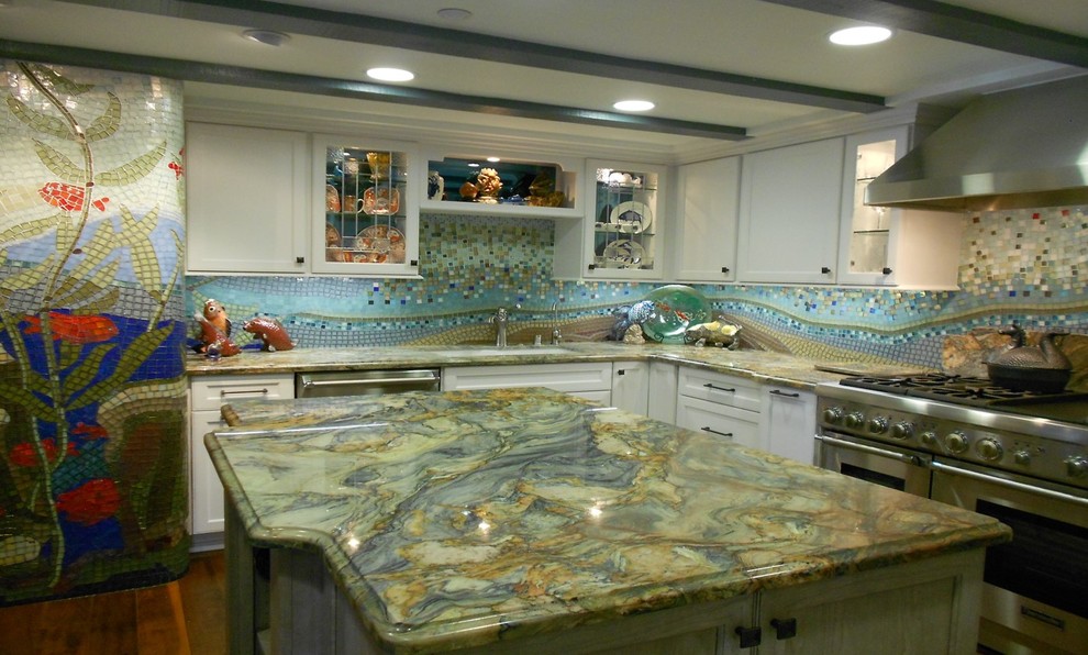 Medium sized classic l-shaped kitchen pantry in Orange County with quartz worktops, multi-coloured splashback, mosaic tiled splashback, stainless steel appliances and an island.