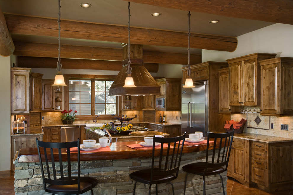 Enclosed kitchen - large rustic u-shaped ceramic tile enclosed kitchen idea in Other with a farmhouse sink, raised-panel cabinets, dark wood cabinets, wood countertops, beige backsplash, ceramic backsplash, stainless steel appliances and two islands