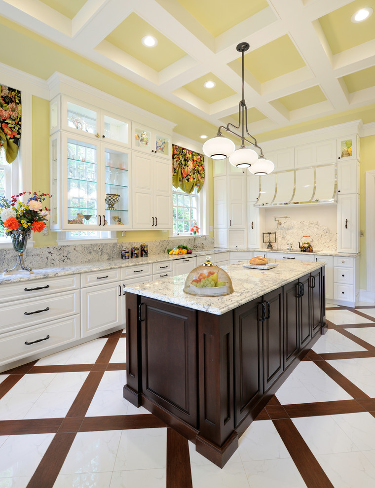 Example of a huge transitional u-shaped porcelain tile enclosed kitchen design in St Louis with white cabinets, granite countertops, an island, raised-panel cabinets, stone slab backsplash and paneled appliances