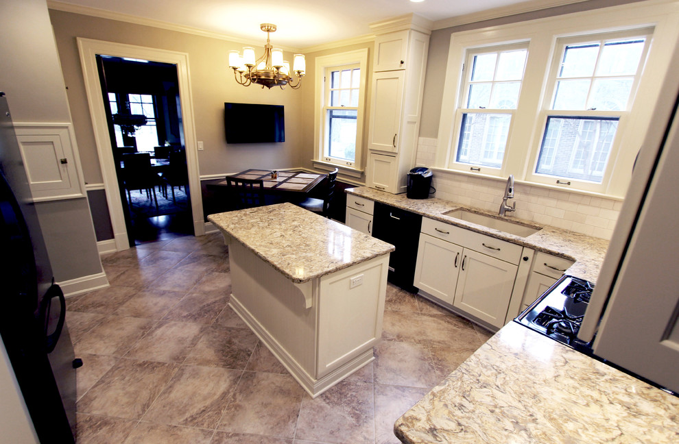 Eat-in kitchen - mid-sized traditional l-shaped porcelain tile eat-in kitchen idea in Cleveland with an undermount sink, flat-panel cabinets, white cabinets, quartz countertops, beige backsplash, porcelain backsplash, black appliances and an island