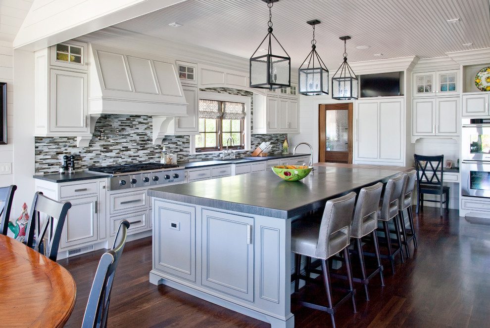 Elegant kitchen photo in Charleston with matchstick tile backsplash, multicolored backsplash, paneled appliances, beaded inset cabinets and white cabinets