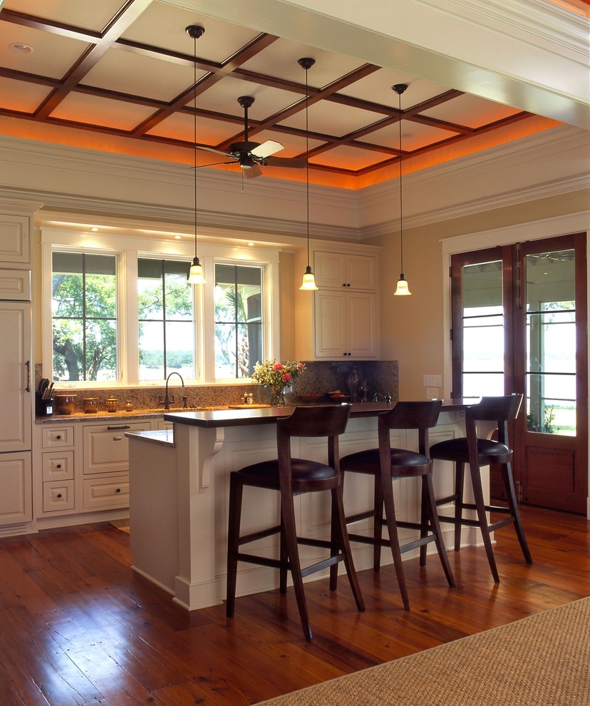 Elegant kitchen photo in Charleston with paneled appliances