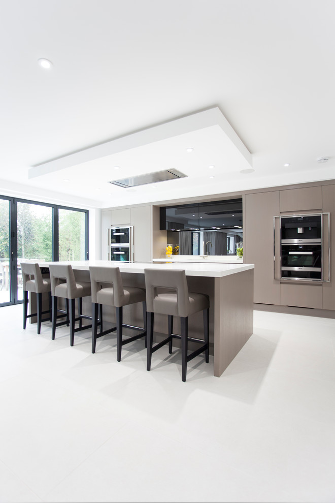Inspiration for an expansive contemporary single-wall open plan kitchen in Other with a submerged sink, flat-panel cabinets, brown cabinets, quartz worktops, grey splashback, mirror splashback, integrated appliances, ceramic flooring and an island.