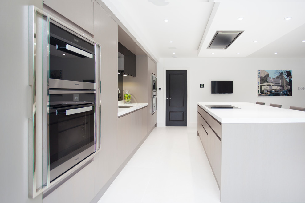 This is an example of an expansive contemporary single-wall open plan kitchen in Other with a submerged sink, flat-panel cabinets, brown cabinets, quartz worktops, grey splashback, mirror splashback, integrated appliances, ceramic flooring and an island.