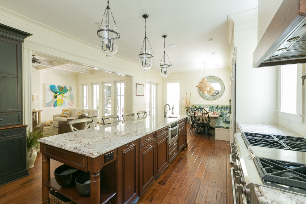 Inspiration for a large contemporary medium tone wood floor kitchen remodel in Charleston with medium tone wood cabinets, stainless steel appliances and an island