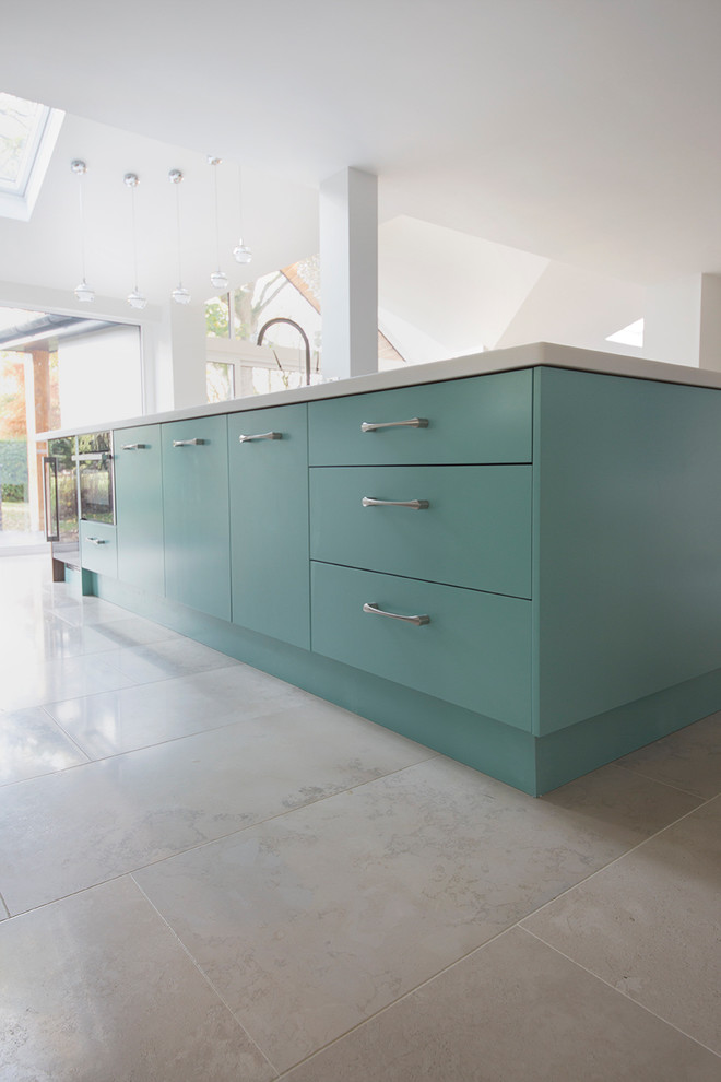 Inspiration for a medium sized contemporary grey and cream kitchen in Other with limestone flooring and an island.