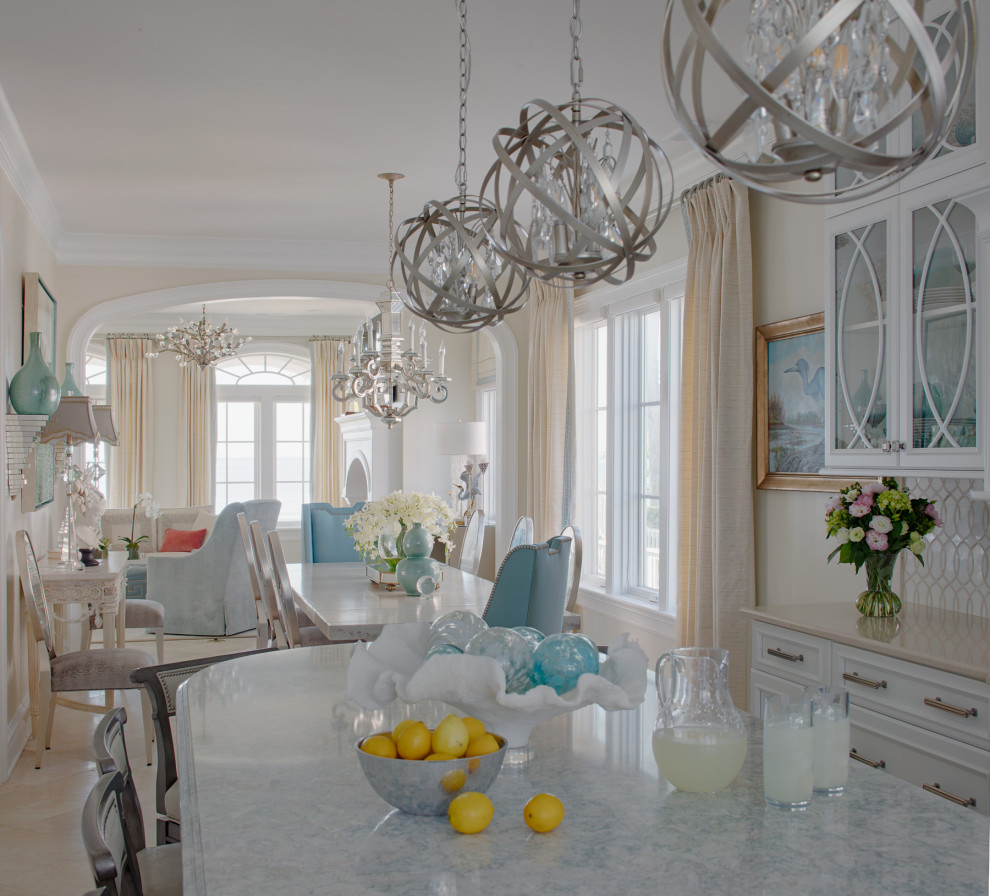 Eat-in kitchen - transitional u-shaped travertine floor and beige floor eat-in kitchen idea in Charleston with raised-panel cabinets, white cabinets, quartz countertops, multicolored backsplash, marble backsplash, stainless steel appliances, an island and multicolored countertops