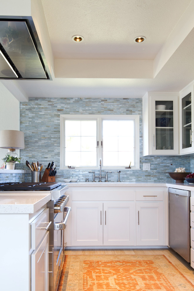 Inspiration for a coastal kitchen remodel in Los Angeles with blue backsplash and glass tile backsplash