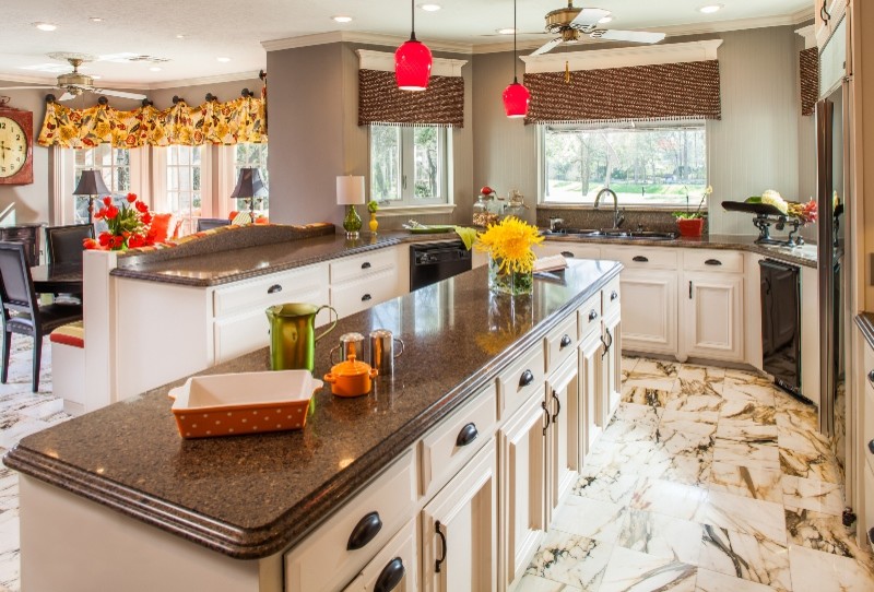Eat-in kitchen - large traditional single-wall marble floor and brown floor eat-in kitchen idea in Houston with recessed-panel cabinets, white cabinets, granite countertops, an island, an undermount sink, black appliances, gray backsplash, wood backsplash and beige countertops