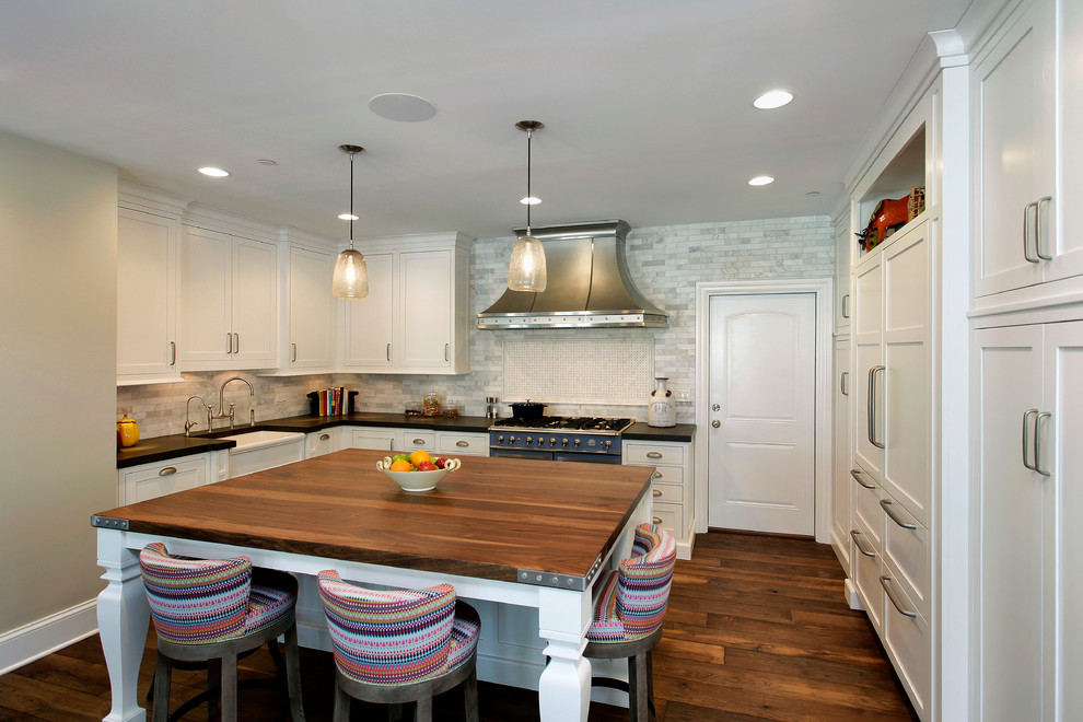 Transitional open concept kitchen photo in Chicago with a farmhouse sink, recessed-panel cabinets and an island