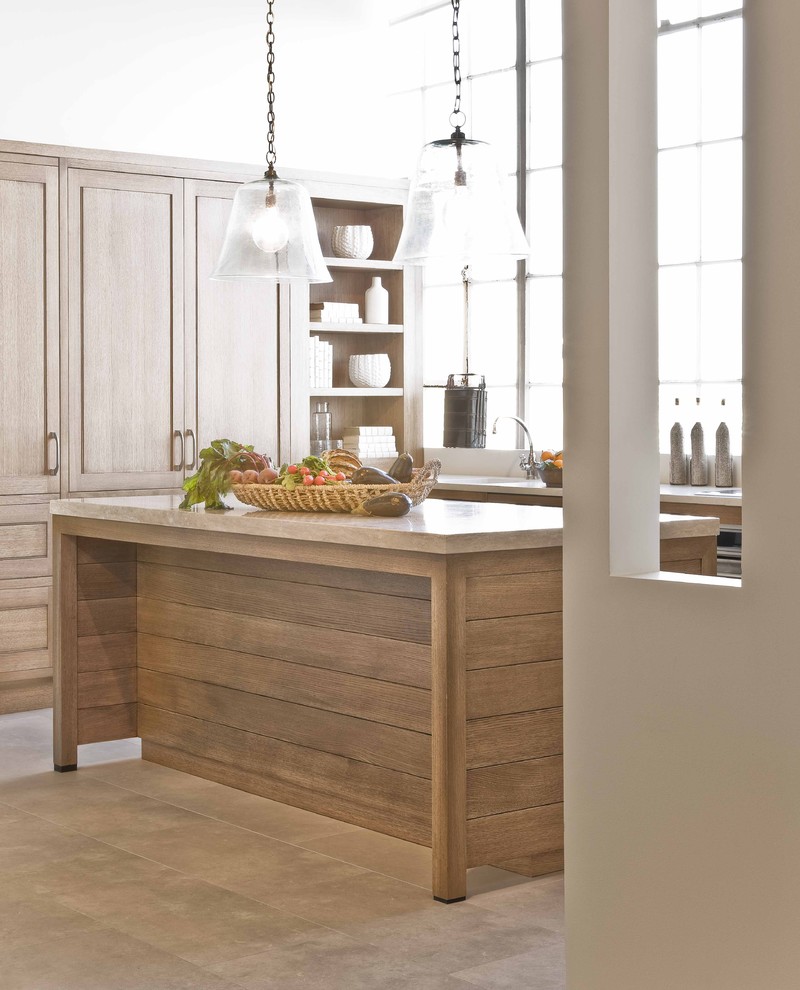 Kitchen - traditional kitchen idea in Boston with light wood cabinets and limestone countertops