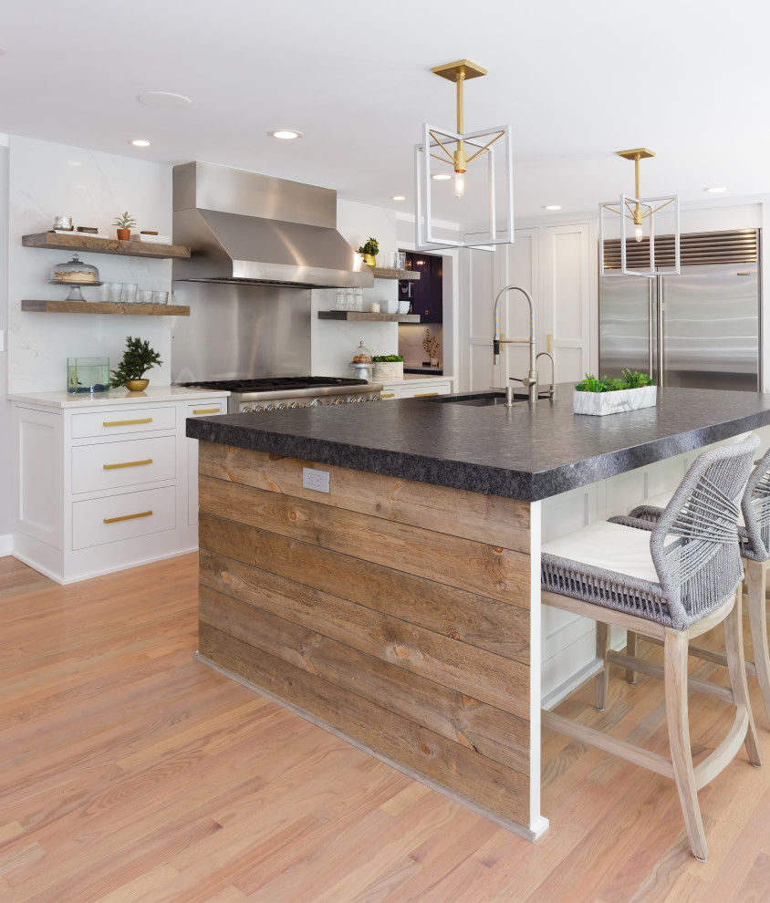 Kitchen - mid-sized contemporary l-shaped medium tone wood floor and beige floor kitchen idea in Other with an undermount sink, recessed-panel cabinets, white cabinets, white backsplash, stainless steel appliances, an island and multicolored countertops