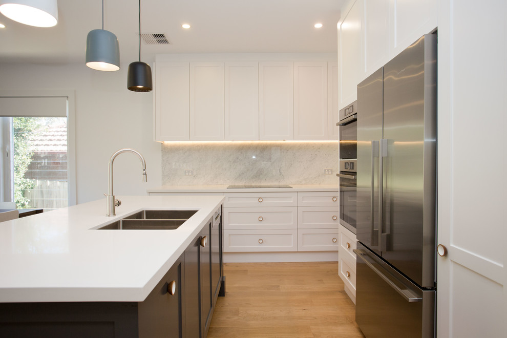 Example of a transitional kitchen design in Sydney