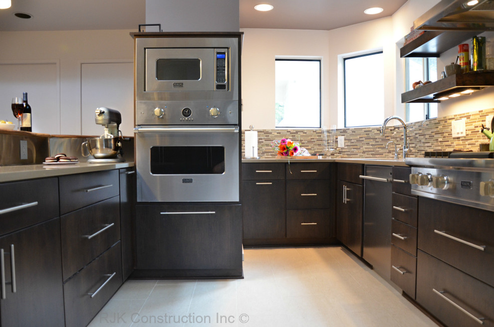 Inspiration for a medium sized contemporary galley open plan kitchen in DC Metro with a submerged sink, flat-panel cabinets, dark wood cabinets, composite countertops, glass tiled splashback, stainless steel appliances, porcelain flooring and an island.