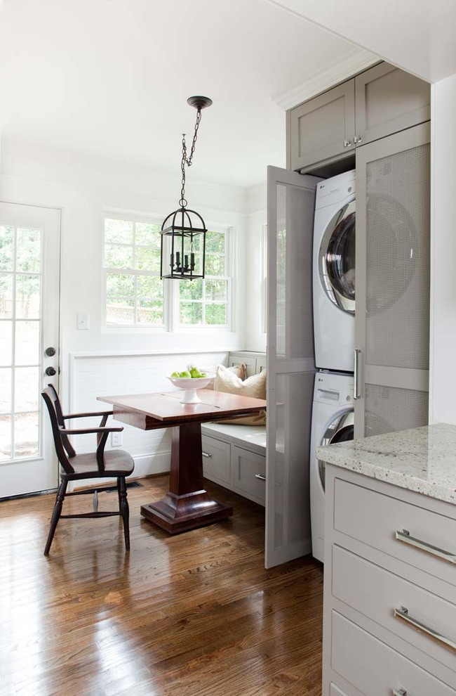 Eat-in kitchen - mid-sized traditional galley medium tone wood floor eat-in kitchen idea in Atlanta with gray cabinets, an undermount sink, granite countertops, white backsplash, subway tile backsplash, stainless steel appliances and an island