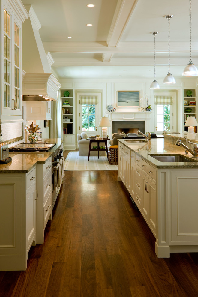 Open concept kitchen - traditional galley open concept kitchen idea in Denver with an undermount sink, beaded inset cabinets and white cabinets