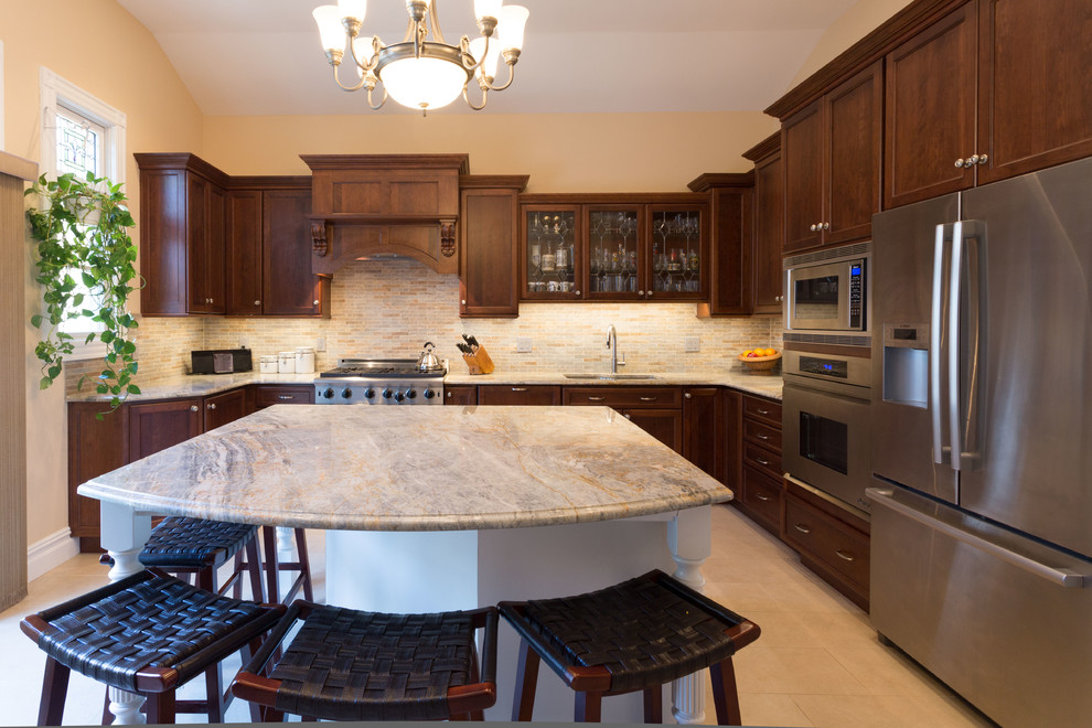Example of a large classic u-shaped ceramic tile and beige floor enclosed kitchen design in New York with an undermount sink, recessed-panel cabinets, medium tone wood cabinets, quartzite countertops, stainless steel appliances, an island, multicolored backsplash and mosaic tile backsplash