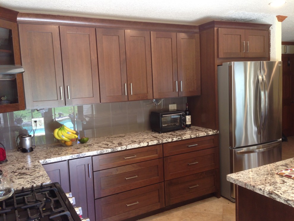 Inspiration for a classic kitchen in Atlanta with shaker cabinets, brown cabinets, granite worktops and an island.