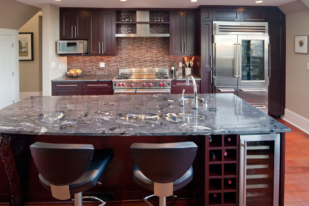 Photo of a modern kitchen in Vancouver with shaker cabinets, red cabinets and an island.
