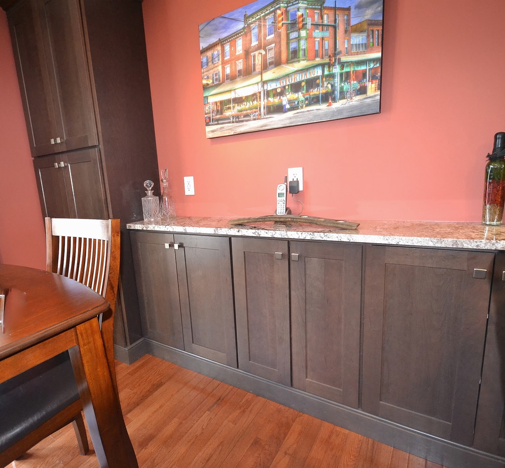 Mid-sized transitional l-shaped medium tone wood floor and brown floor eat-in kitchen photo in Philadelphia with an undermount sink, shaker cabinets, medium tone wood cabinets, granite countertops, beige backsplash, subway tile backsplash, stainless steel appliances and a peninsula