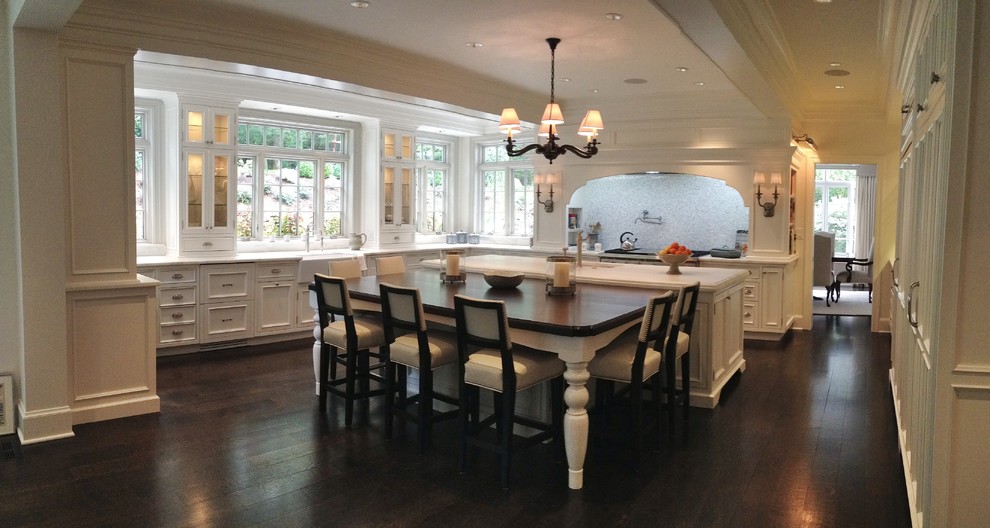 Eat-in kitchen - huge transitional u-shaped dark wood floor eat-in kitchen idea in St Louis with an undermount sink, recessed-panel cabinets, white cabinets, marble countertops, mosaic tile backsplash, paneled appliances and an island