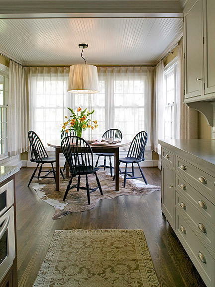 Eat-in kitchen - mid-sized traditional galley dark wood floor eat-in kitchen idea in DC Metro with shaker cabinets, concrete countertops, white backsplash, an island, subway tile backsplash, stainless steel appliances and a single-bowl sink