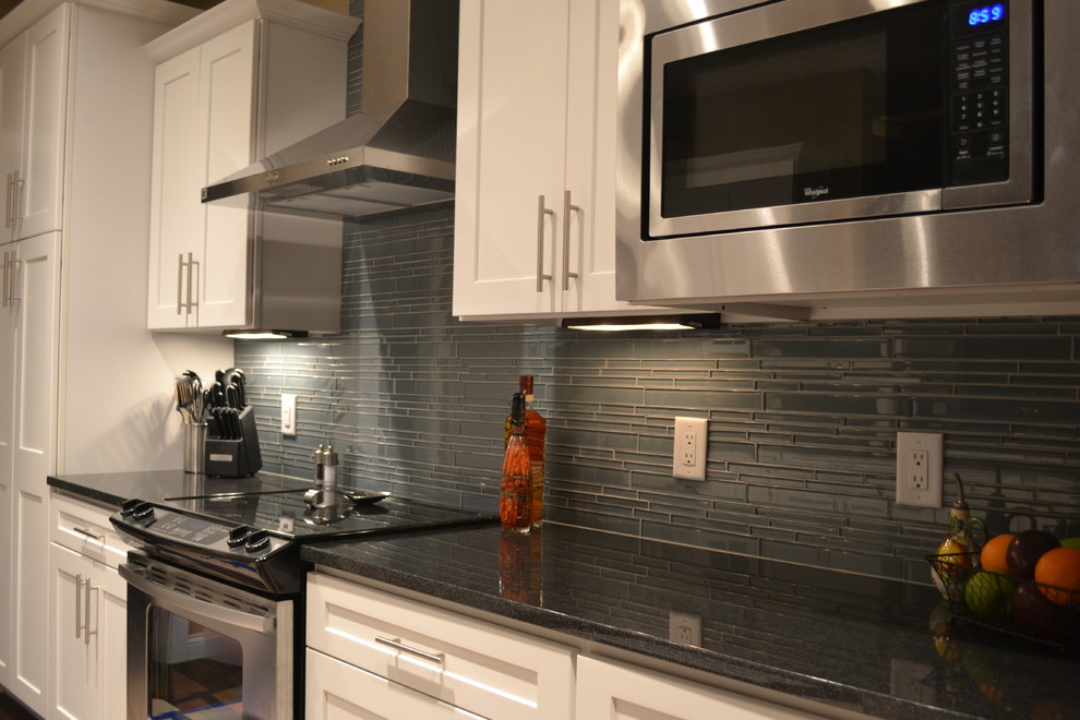 Example of a trendy kitchen design in Vancouver with gray backsplash and glass tile backsplash