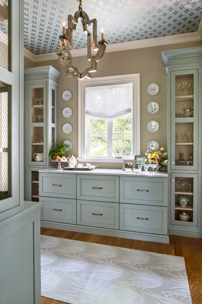 Inspiration for a small traditional galley kitchen pantry in DC Metro with beaded cabinets, blue cabinets, quartz worktops, medium hardwood flooring and no island.