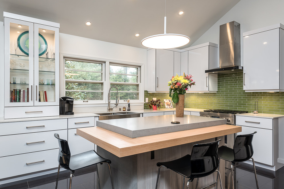 Mid-sized trendy l-shaped kitchen photo in Other with an undermount sink, flat-panel cabinets, quartzite countertops, green backsplash, glass tile backsplash, stainless steel appliances, an island and white cabinets