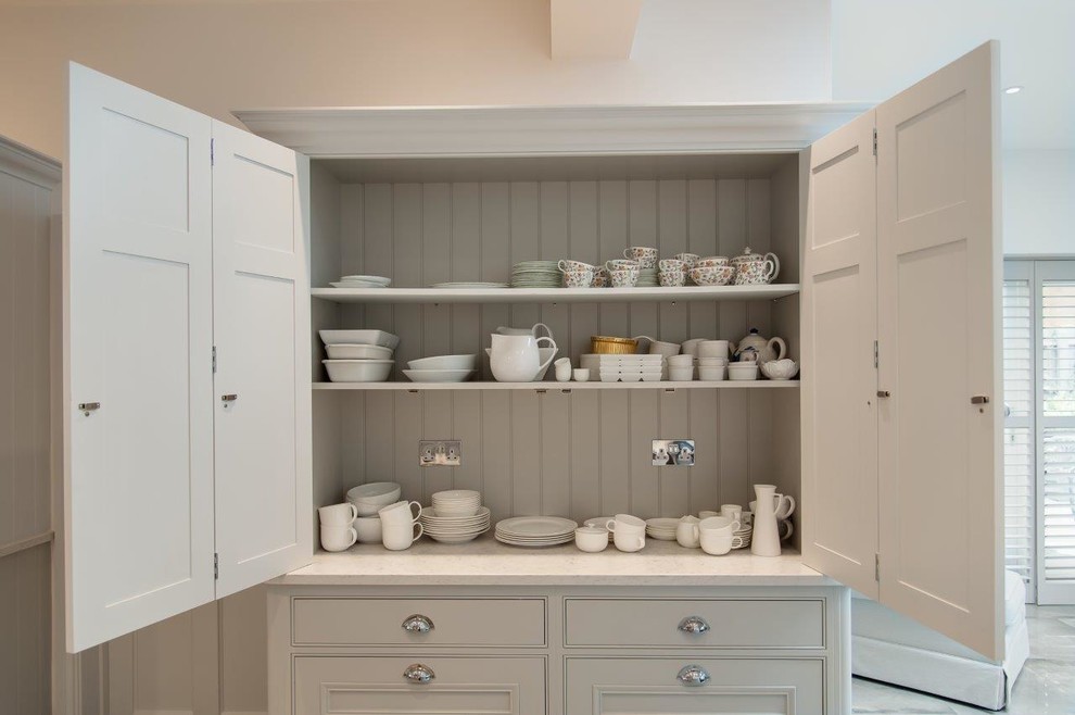 Inspiration for a large classic u-shaped kitchen/diner in Hertfordshire with an integrated sink, beaded cabinets, grey cabinets, quartz worktops, grey splashback, ceramic splashback, white appliances, ceramic flooring, no island and grey floors.