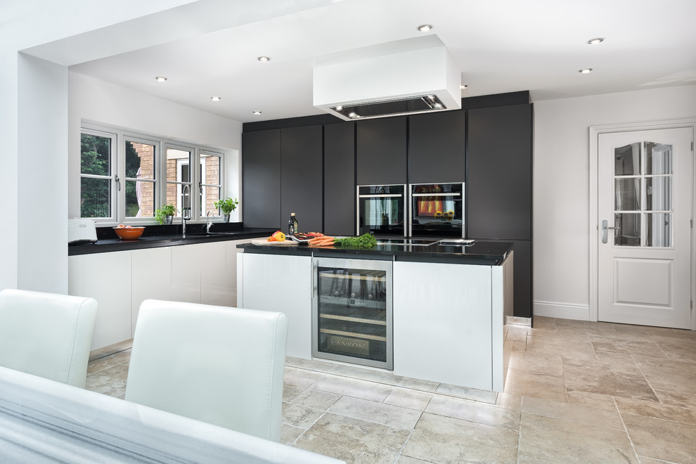 Photo of a medium sized contemporary kitchen/diner in Other with a submerged sink, glass-front cabinets, black cabinets, quartz worktops, stainless steel appliances and an island.