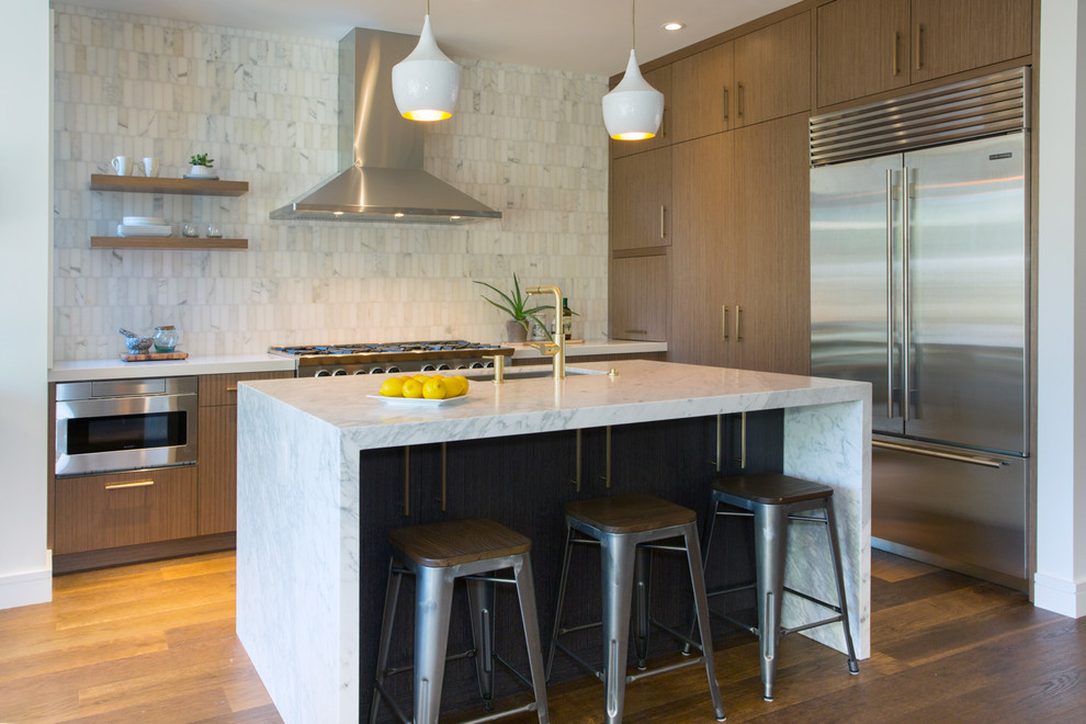 Trendy dark wood floor kitchen photo in San Francisco with an undermount sink, flat-panel cabinets, medium tone wood cabinets, multicolored backsplash, stainless steel appliances and an island